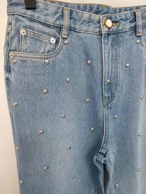 Étoile comme des boutons sur les jambes Denim Fond pour un look unique, exceptionnel