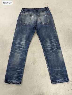 Jeans à jantes droites avec moustache pour un look vintage