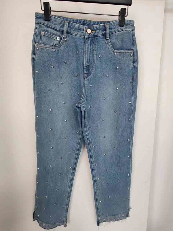 Étoile comme des boutons sur les jambes Denim Fond pour un look unique, exceptionnel
